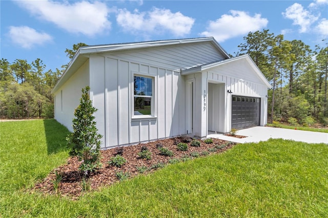 12197 SW 76th Ln, Dunnellon, FL 34432 - view of front of house featuring board and batten siding, a garage, and concrete driveway