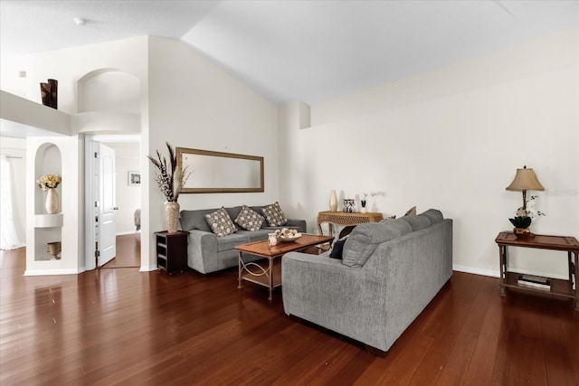 14617 Keelford Way, Orlando, FL 32824 - living area featuring wood finished floors, high vaulted ceiling, and baseboards
