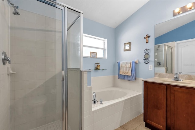 14617 Keelford Way, Orlando, FL 32824 - full bath featuring a shower stall, a bath, vanity, tile patterned floors, and lofted ceiling