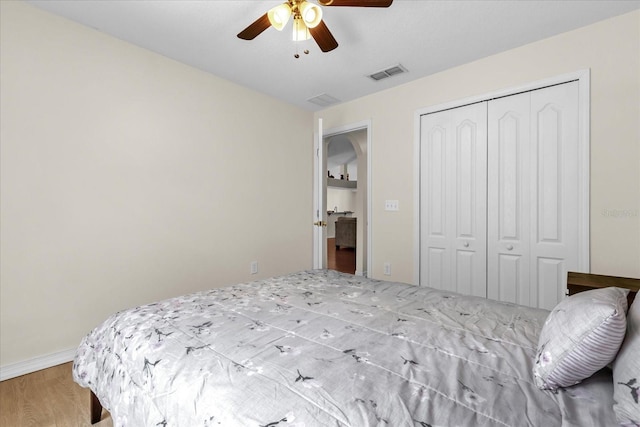 14617 Keelford Way, Orlando, FL 32824 - bedroom featuring a closet, wood finished floors, a ceiling fan, and baseboards