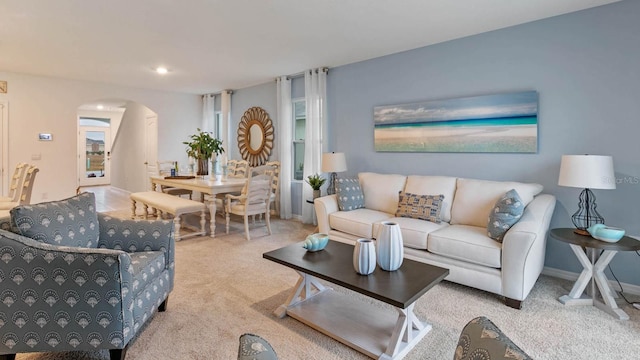 3507 Costello Cir, Winter Haven, FL 33884 - living area with arched walkways, carpet, and baseboards