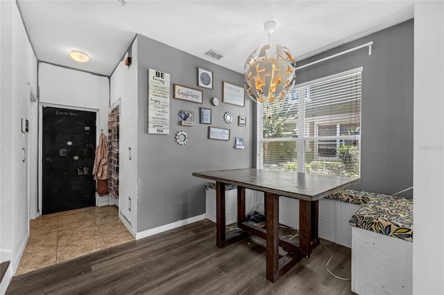 2330 Little Gem Loop, Sanford, FL 32773 - dining room with wood finished floors, a chandelier, and baseboards