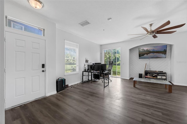 2330 Little Gem Loop, Sanford, FL 32773 - foyer with dark wood finished floors, baseboards, arched walkways, and ceiling fan