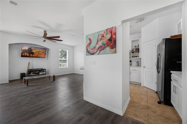 2330 Little Gem Loop, Sanford, FL 32773 - kitchen featuring freestanding refrigerator, a ceiling fan, white cabinets, open floor plan, and wood finished floors