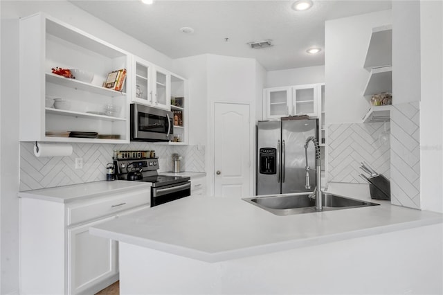 2330 Little Gem Loop, Sanford, FL 32773 - kitchen with appliances with stainless steel finishes, open shelves, a sink, tasteful backsplash, and recessed lighting