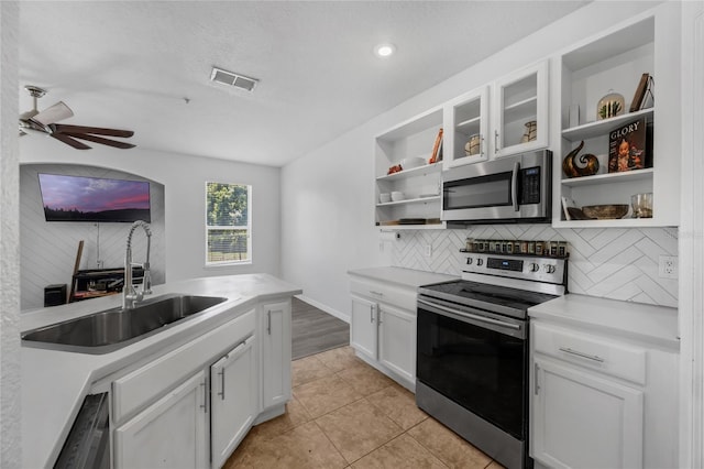 2330 Little Gem Loop, Sanford, FL 32773 - kitchen with appliances with stainless steel finishes, open shelves, a sink, decorative backsplash, and recessed lighting