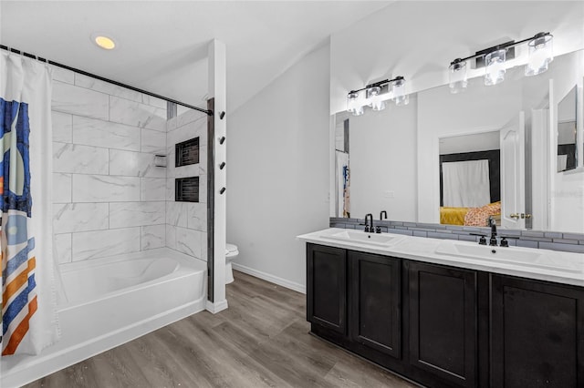 2330 Little Gem Loop, Sanford, FL 32773 - full bath with toilet, wood finished floors, shower / tub combo, double vanity, and baseboards
