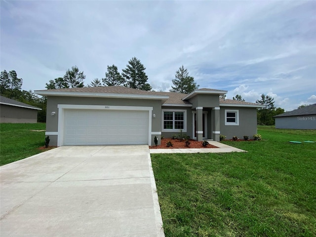851 Marion Oaks Mnr, Ocala, FL 34473 - view of front of home featuring concrete driveway, an attached garage, stucco siding, a front yard, and roof with shingles