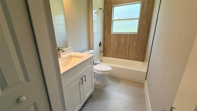 851 Marion Oaks Mnr, Ocala, FL 34473 - bathroom with toilet, vanity, washtub / shower combination, and a textured wall