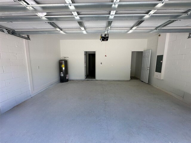 851 Marion Oaks Mnr, Ocala, FL 34473 - garage featuring water heater, electric panel, and a garage door opener
