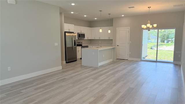 475 Marion Oaks Mnr, Ocala, FL 34473 - kitchen featuring stainless steel appliances, a chandelier, baseboards, light countertops, and recessed lighting