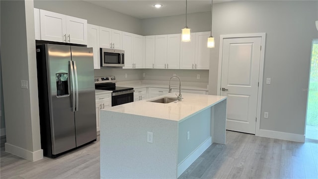 475 Marion Oaks Mnr, Ocala, FL 34473 - kitchen with appliances with stainless steel finishes, a sink, light wood-style flooring, and white cabinetry