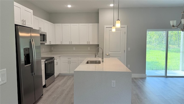 475 Marion Oaks Mnr, Ocala, FL 34473 - kitchen featuring stainless steel appliances, a sink, light wood-style floors, white cabinets, and recessed lighting