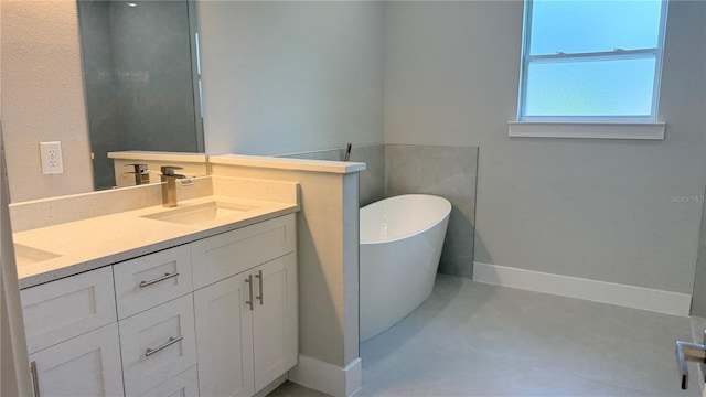 475 Marion Oaks Mnr, Ocala, FL 34473 - full bathroom with a freestanding bath, double vanity, baseboards, and concrete flooring