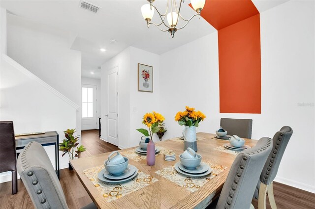 1615 Sanibel Dr, Davenport, FL 33896 - dining area featuring a chandelier, wood finished floors, baseboards, and recessed lighting