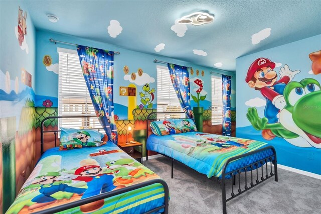 1615 Sanibel Dr, Davenport, FL 33896 - bedroom featuring a textured ceiling, baseboards, and carpet floors