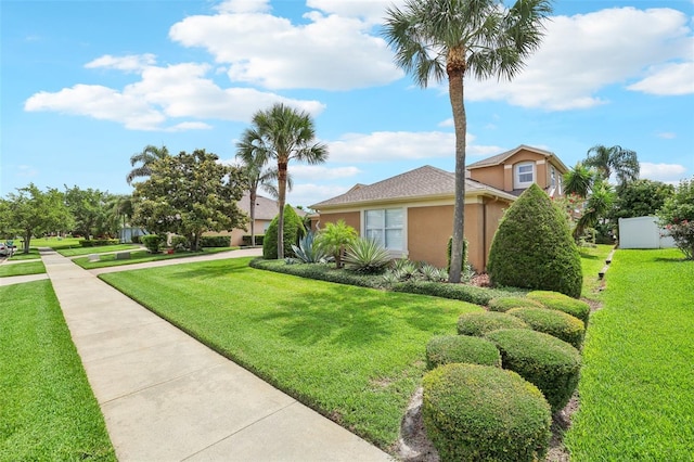 13524 Glynshel Dr, Winter Garden, FL 34787 - view of property exterior featuring stucco siding and a yard