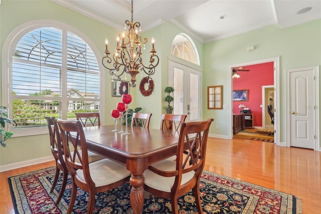 13524 Glynshel Dr, Winter Garden, FL 34787 - dining space with wood finished floors, crown molding, plenty of natural light, and baseboards