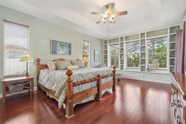 13524 Glynshel Dr, Winter Garden, FL 34787 - bedroom featuring dark wood-style floors, a tray ceiling, and ceiling fan
