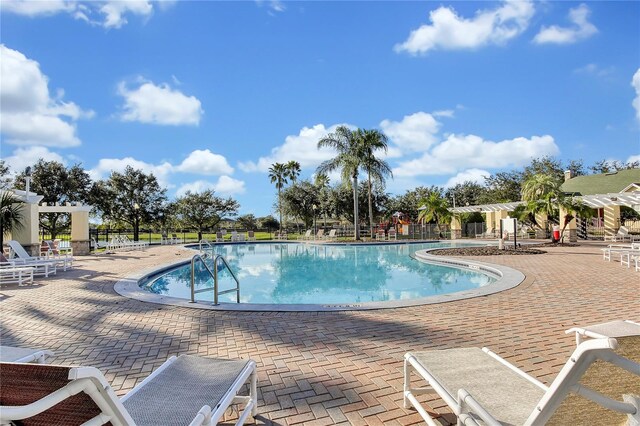 13524 Glynshel Dr, Winter Garden, FL 34787 - community pool featuring a patio and fence