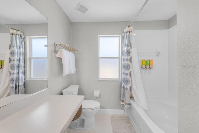 2706 Camaro Dr, Kissimmee, FL 34746 - bathroom featuring toilet, tile patterned flooring, shower / bath combo, and baseboards