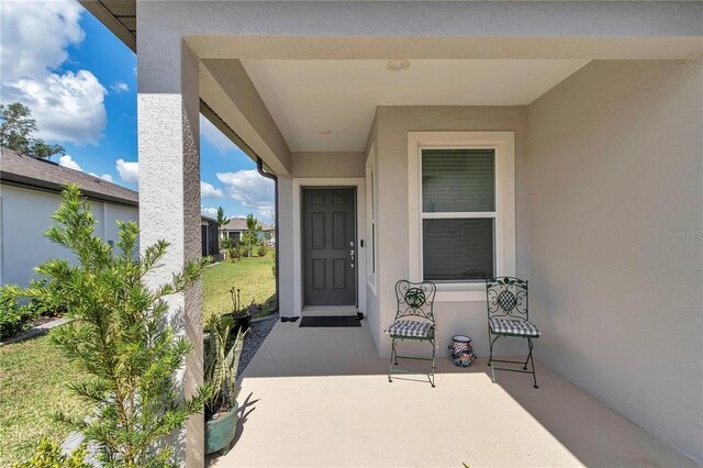 8413 SW 54th Loop, Ocala, FL 34481 - doorway to property with stucco siding