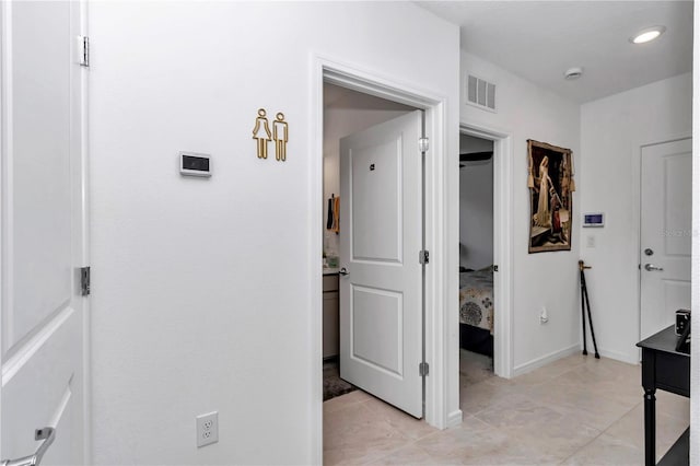 8413 SW 54th Loop, Ocala, FL 34481 - hallway with light tile patterned floors