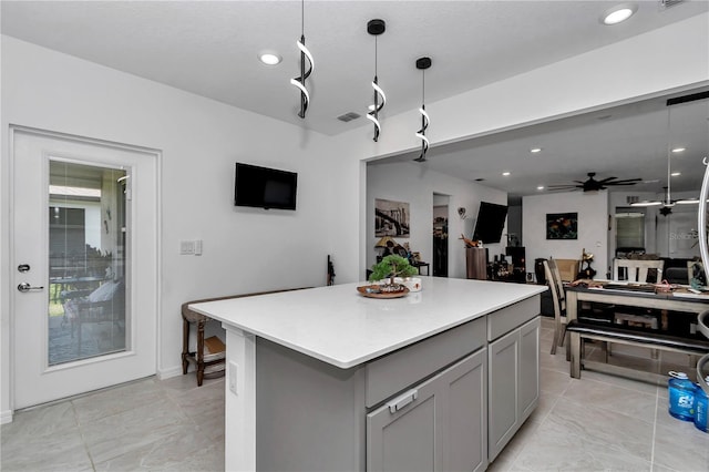 8413 SW 54th Loop, Ocala, FL 34481 - kitchen featuring gray cabinetry, a center island, light countertops, recessed lighting, and a ceiling fan