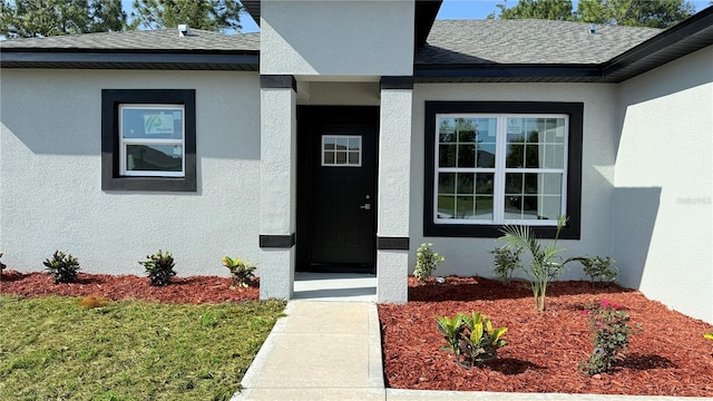 7382 SW 129th Ln, Ocala, FL 34473 - property entrance featuring stucco siding and roof with shingles