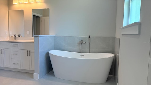 7382 SW 129th Ln, Ocala, FL 34473 - full bathroom featuring double vanity and a freestanding tub