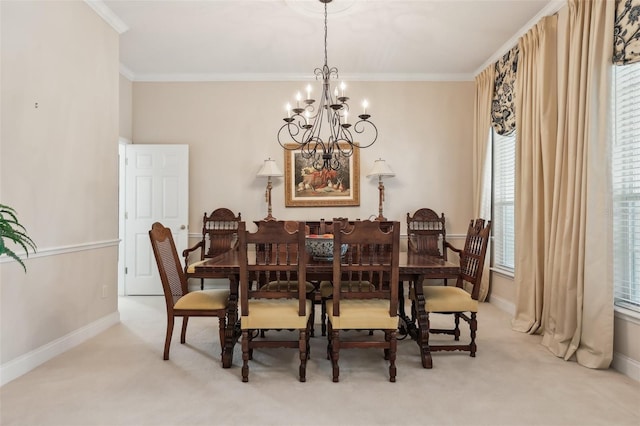 carpeted dining space with a chandelier, crown molding, and baseboards