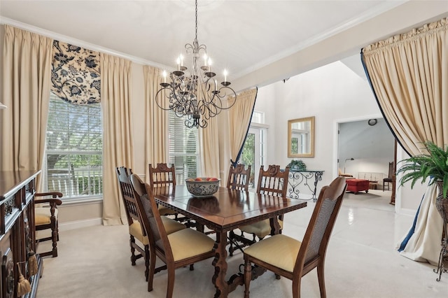 dining room featuring crown molding, a chandelier, baseboards, plenty of natural light, and light carpet