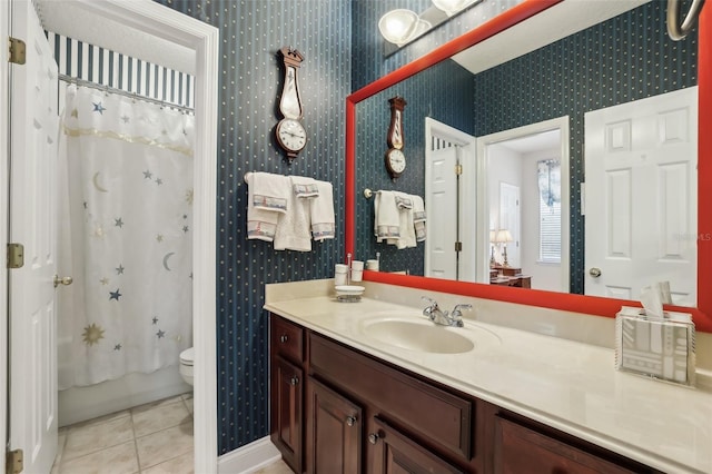 full bath featuring wallpapered walls, tile patterned flooring, vanity, toilet, and shower / tub combo with curtain