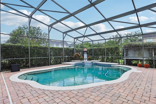 swimming pool with a patio area and a lanai