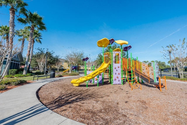communal playground featuring fence