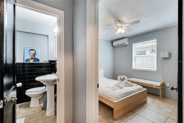 bathroom with tile patterned flooring, a wall unit AC, ceiling fan, toilet, and ornamental molding