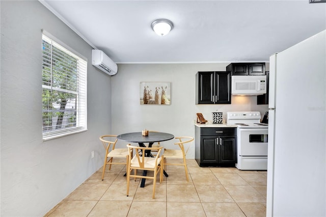 kitchen featuring white appliances, an AC wall unit, dark cabinetry, light tile patterned floors, and light countertops