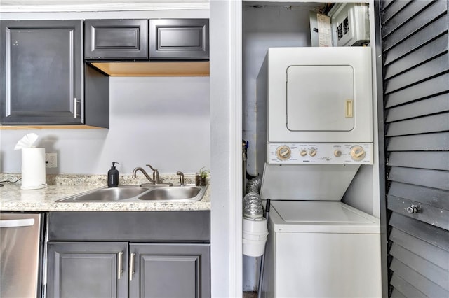 laundry room featuring estacked washer and dryer
