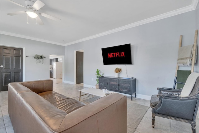 living area featuring ornamental molding, light tile patterned floors, ceiling fan, and baseboards