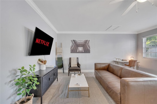 living room with crown molding, light tile patterned floors, ceiling fan, and baseboards
