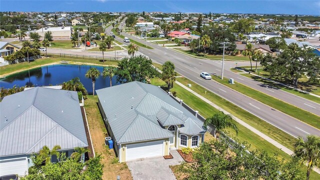 aerial view of residential area with a large body of water