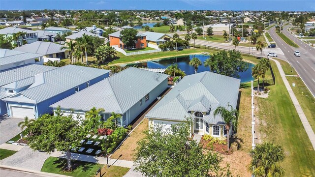 aerial view of residential area with a large body of water