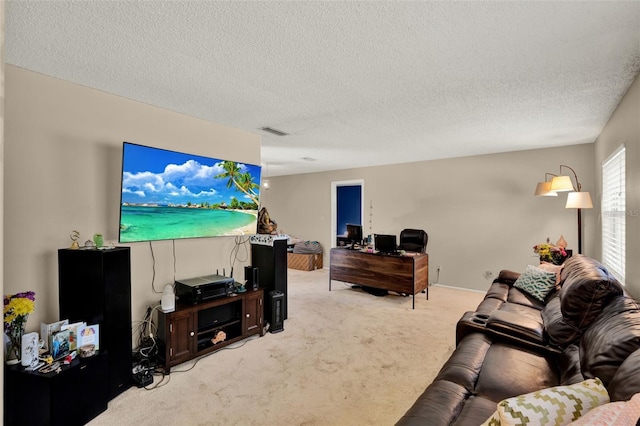 living area featuring light carpet and a textured ceiling