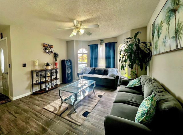 2376 Flamingo Lakes Dr, Kissimmee, FL 34743 - living room featuring ceiling fan, wood finished floors, a textured ceiling, and baseboards