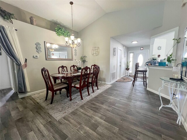 2376 Flamingo Lakes Dr, Kissimmee, FL 34743 - dining room with dark wood-style flooring, vaulted ceiling, baseboards, and a chandelier