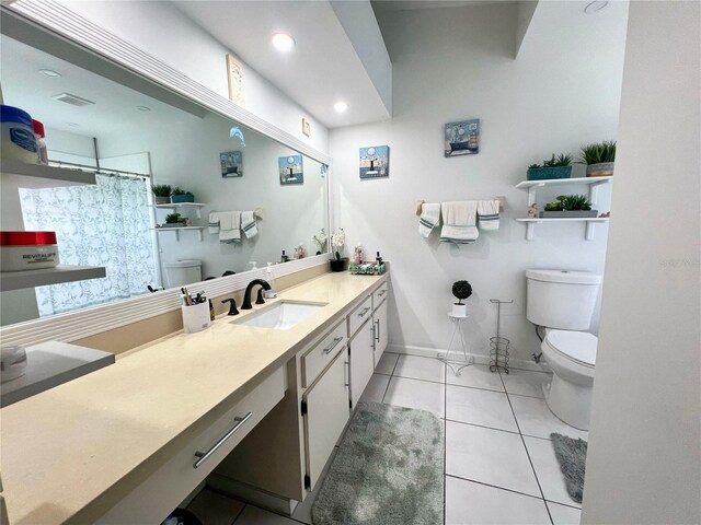 2376 Flamingo Lakes Dr, Kissimmee, FL 34743 - full bath with toilet, vanity, tile patterned floors, curtained shower, and baseboards
