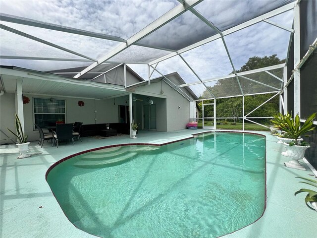 2376 Flamingo Lakes Dr, Kissimmee, FL 34743 - swimming pool featuring a patio area and a lanai