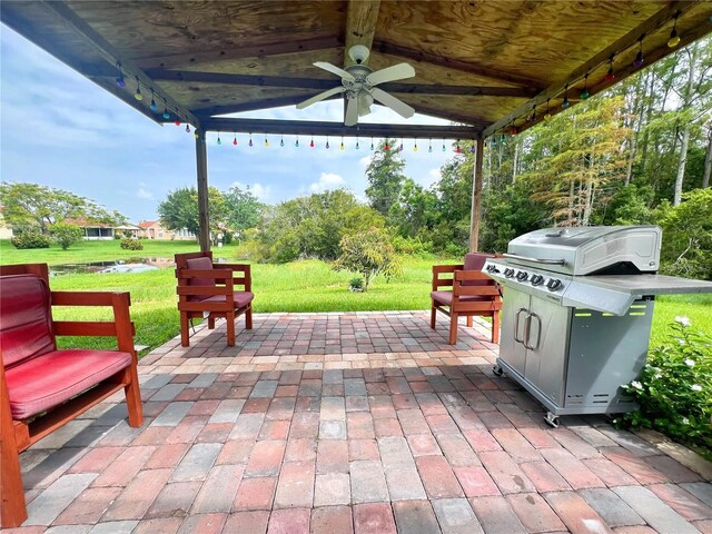 2376 Flamingo Lakes Dr, Kissimmee, FL 34743 - view of patio / terrace featuring a ceiling fan, a grill, and a gazebo