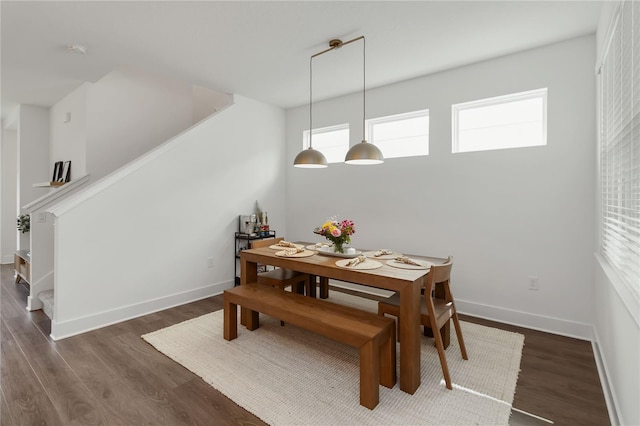 15408 Lebeau Loop, Winter Garden, FL 34787 - dining area with wood finished floors, healthy amount of natural light, baseboards, and stairs