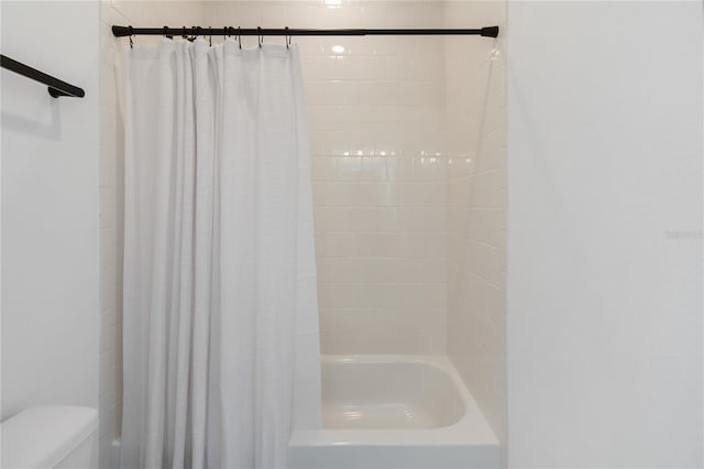 15408 Lebeau Loop, Winter Garden, FL 34787 - bathroom with toilet and shower / bath combo with shower curtain